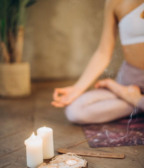 Woman in a peaceful yoga pose, embodying harmony and balance.
